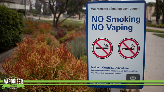 A public sign stating NO smoking and NO Vaping.